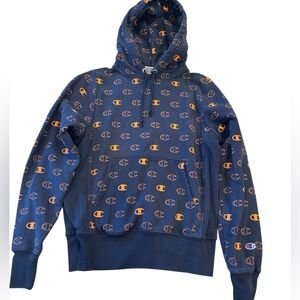 Champion boys navy blue Hoodie with Orange Logo Pattern. Size S